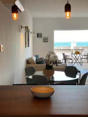 a living room with a table and a couch at The Ocean View Luz in Luz