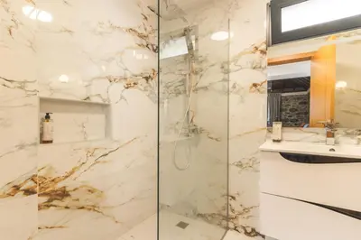 a bathroom with a shower and a sink at Julianas House 1 by Atlantic Holiday in Campanário