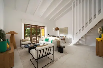 a living room with a couch and a table at 2 bdr Villa with Ocean-View Shared Pool, Luz, Lagos in Luz