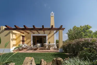 a patio with a lighthouse on top of a house at 2 bdr Villa with Ocean-View Shared Pool, Luz, Lagos in Luz