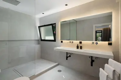 a bathroom with a sink and a mirror at Garden Villa by An Island Apart in Funchal