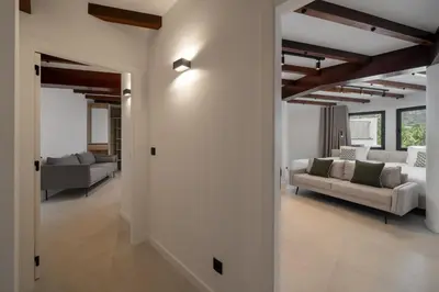 a black chair in a room with a washing machine at Garden Villa by An Island Apart in Funchal