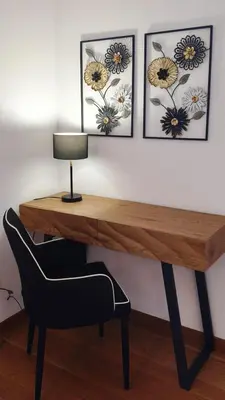 a desk with a chair and three pictures on the wall at Stay In Funchal- Alto da Pena Apartment in Funchal