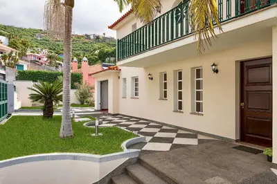 a villa with a checkered floor and a house at Taste of the Sea by Formosa in Funchal