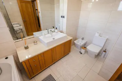 a bathroom with a sink and a toilet at Madalenas Sun&Sea in Funchal