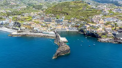 an aerial view of a small island in the ocean at Lobos Village in Câmara de Lobos