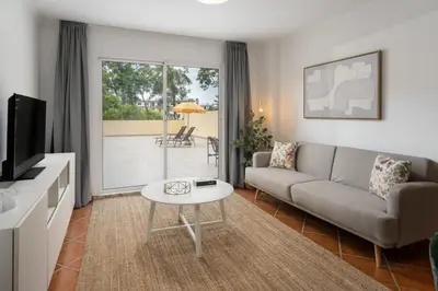 a living room with a couch and a table at Apartamento da Silva by An Island Apart in Funchal
