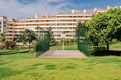 a gate in front of a large building at Apartamento da Silva by An Island Apart in Funchal
