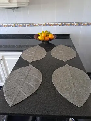 a kitchen counter with a bowl of fruit on it at Casa Sequeira in Fajã da Ovelha