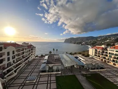 a view of the ocean from a building at Sunset Ocean View Apartment in Funchal