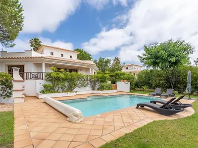 a swimming pool in a yard with a house at Peaceful and lovely retreat with a pool #1982 in Barão de São Miguel