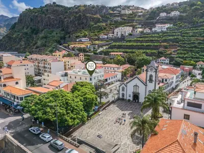 an aerial view of a city with a mountain at Rumo by KAAMAH in Ribeira Brava