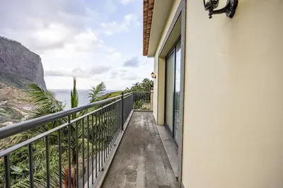 a balcony with a view of the ocean at Ricardo's Village by YOUR KEY in Porto da Cruz