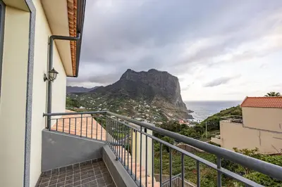 a balcony with a view of the ocean at Ricardo's Village by YOUR KEY in Porto da Cruz