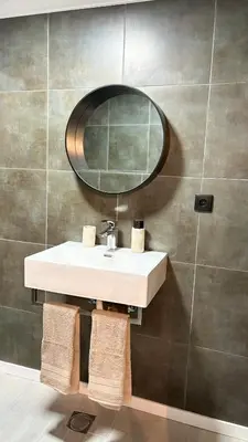 a bathroom with a sink and a mirror at Old Aqueduct Village 1 - Guesthouse - Madeira in Serra de Água