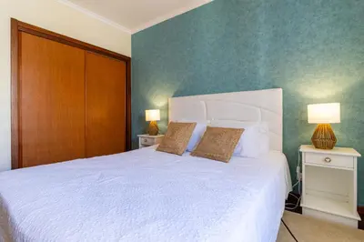 a hallway with a desk with a lamp and a room at Piornais Views, perto da Praia Formosa in Funchal