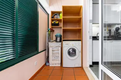 a beach with rocks and the ocean and buildings at Piornais Views, perto da Praia Formosa in Funchal