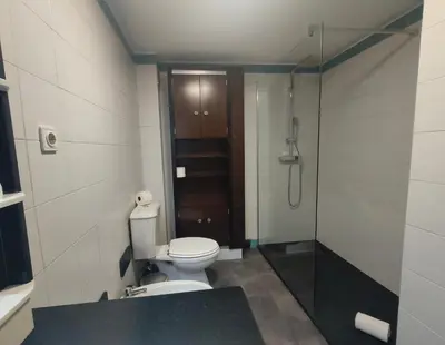 a bathroom with a toilet and a shower at Piornais Views, perto da Praia Formosa in Funchal