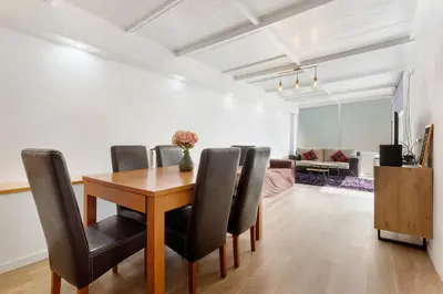 a dining room with a table and chairs at Moradia Centro Da Cidade Funchal in Funchal