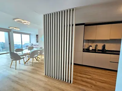 a kitchen and dining room with a table and chairs at Beautiful View by Rentallido in Funchal