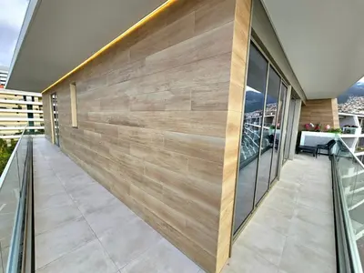 a wooden wall on the side of a house at Beautiful View by Rentallido in Funchal