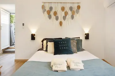 a bedroom with a bed with two pillows on it at Seaside Haven - Soulful Stays in Porto Moniz