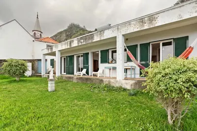 a house with a green and white at Blissful Haven - Soulful Stays in Porto Moniz