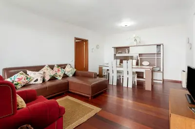 a living room with a couch and a table at Blissful Haven - Soulful Stays in Porto Moniz