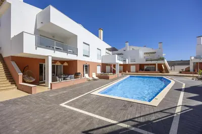 an image of a house with a swimming pool at Casa do Mar in Burgau