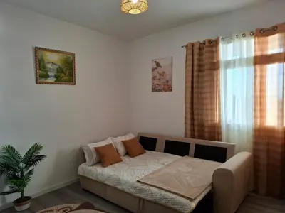 a bedroom with a large bed with two pillows on it at Varanda Encantada House in Ponta do Sol