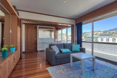 a living room with a couch and a table at Top Floor Apartment 805 in Funchal