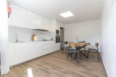 a kitchen and dining room with a table and chairs at Julianas House 2 by Atlantic Holiday in Campanário