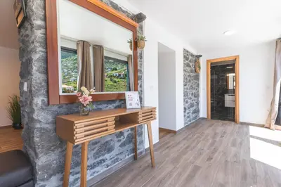 a room with a vanity and a mirror on a wall at Julianas House 2 by Atlantic Holiday in Campanário
