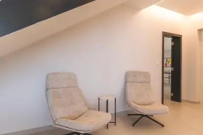 two chairs and a table in a room at Villa Zenha by Atlantic Holiday in Ribeira Brava