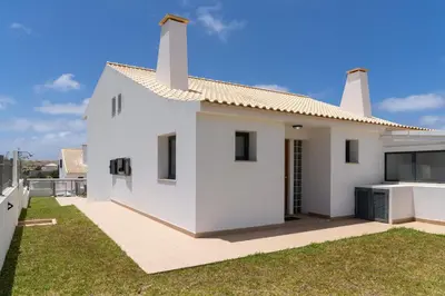 a white house with a yard at MarAnteMar by An Island Apart in Porto Santo