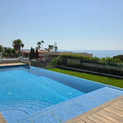 a swimming pool with a view of the ocean at Casa Azul in Luz