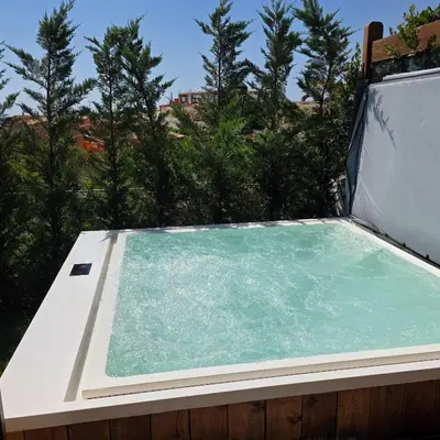 a swimming pool on a roof with trees in the background at Casa Azul in Luz