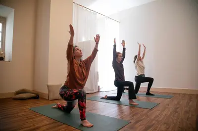 a group of people doing yoga in a room at Casa Fidal in Bordeira