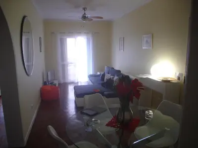 a living room with a couch and a glass table at Shearwaternest Apartment AL in Funchal