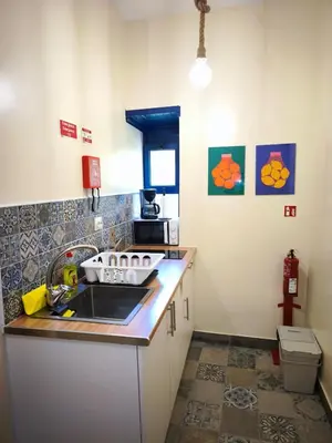 a kitchen with a sink and a counter top at Studio Cascata da Giesta in Câmara de Lobos