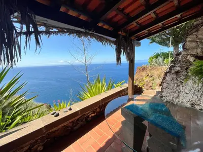 a swimming pool with a view of the ocean at PRIVATE OCEANFRONT DELUXE VILLA PICO 360 VIEWs in Funchal