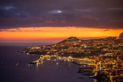 a view of the amalfi coast at sunset at PRIVATE OCEANFRONT DELUXE VILLA PICO 360 VIEWs in Funchal