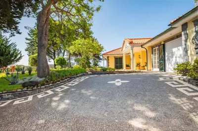a driveway in front of a house at PRIVATE OCEANFRONT DELUXE VILLA PICO 360 VIEWs in Funchal