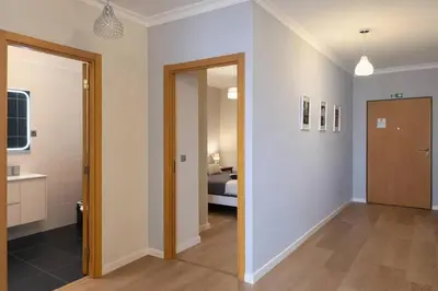 a hallway with a door leading to a bedroom at Titou Apartment Sea View in Santa Cruz