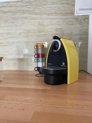 a yellow and black appliance sitting on a wooden floor at Sea La Vie Apartment Porto Santo in Porto Santo