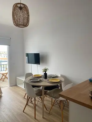 a kitchen and dining room with a table and chairs at Sea La Vie Apartment Porto Santo in Porto Santo