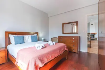 a bedroom with a bed with two towels on it at Casa dos Namora by Atlantic Holiday in Câmara de Lobos