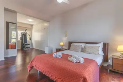 a bedroom with a bed with two towels on it at Casa dos Namora by Atlantic Holiday in Câmara de Lobos