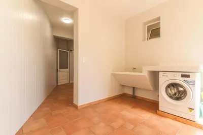 a laundry room with a washer and dryer at Casa dos Namora by Atlantic Holiday in Câmara de Lobos