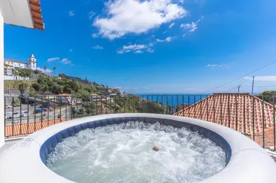 a hot tub on top of a building at Casa dos Namora by Atlantic Holiday in Câmara de Lobos